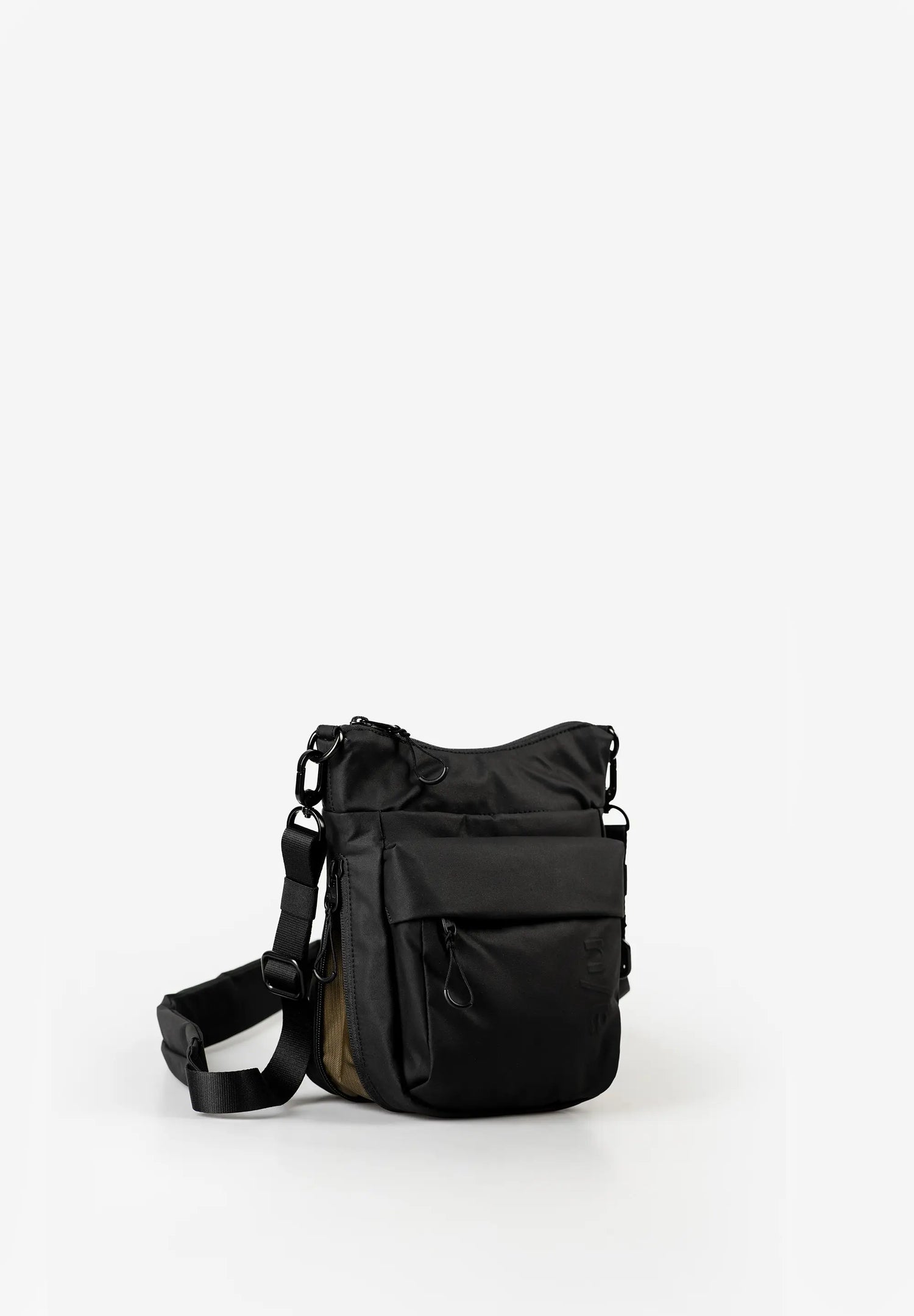 Aunts & Uncles Yura RE Lite Crossbody Bag.A black nylon shoulder bag with a front zippered pocket and an adjustable shoulder strap, photographed on a seamless white studio background.
