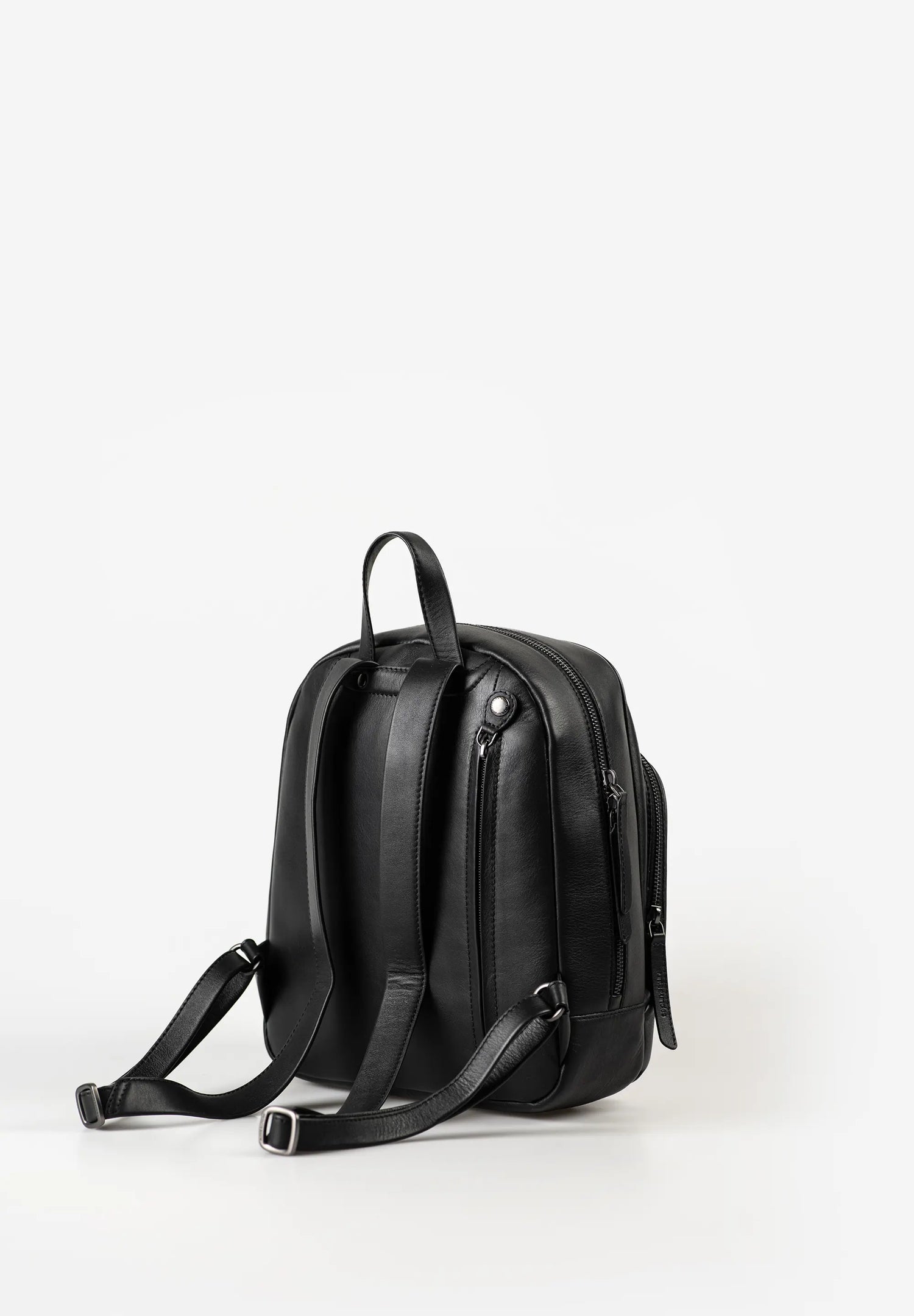 Aunts & Uncles Coco Leather Backpack Purse A black leather backpack shown from a side profile view against a clean white studio background.