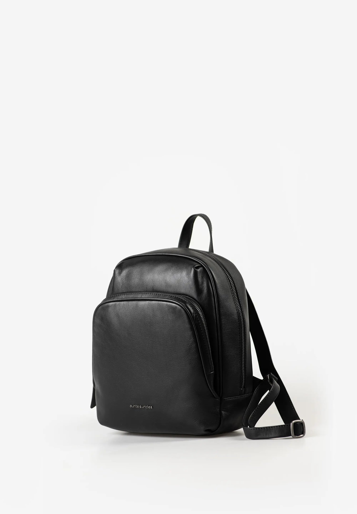 Aunts & Uncles Coco Leather Backpack Purse A black leather backpack with a front zippered pocket and adjustable shoulder strap, photographed on a clean white studio background.