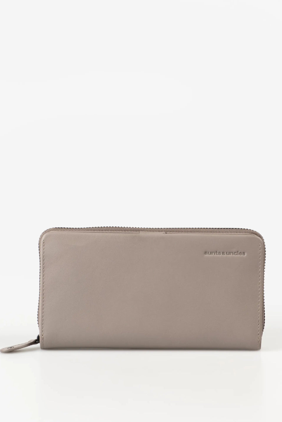 Aunts & Uncles Maple Leather Wallet. A taupe leather zip-around wallet with a small debossed 'marisa casals' logo on the right side, shown against a plain white background.
