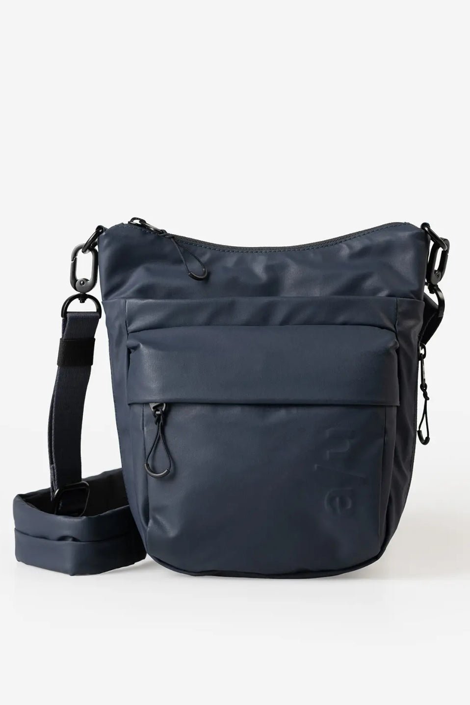 Aunts & Uncles Yura RE Lite Crossbody Bag. A dark navy blue nylon shoulder bag with a front zippered pocket and an adjustable shoulder strap, displayed on a clean white background.