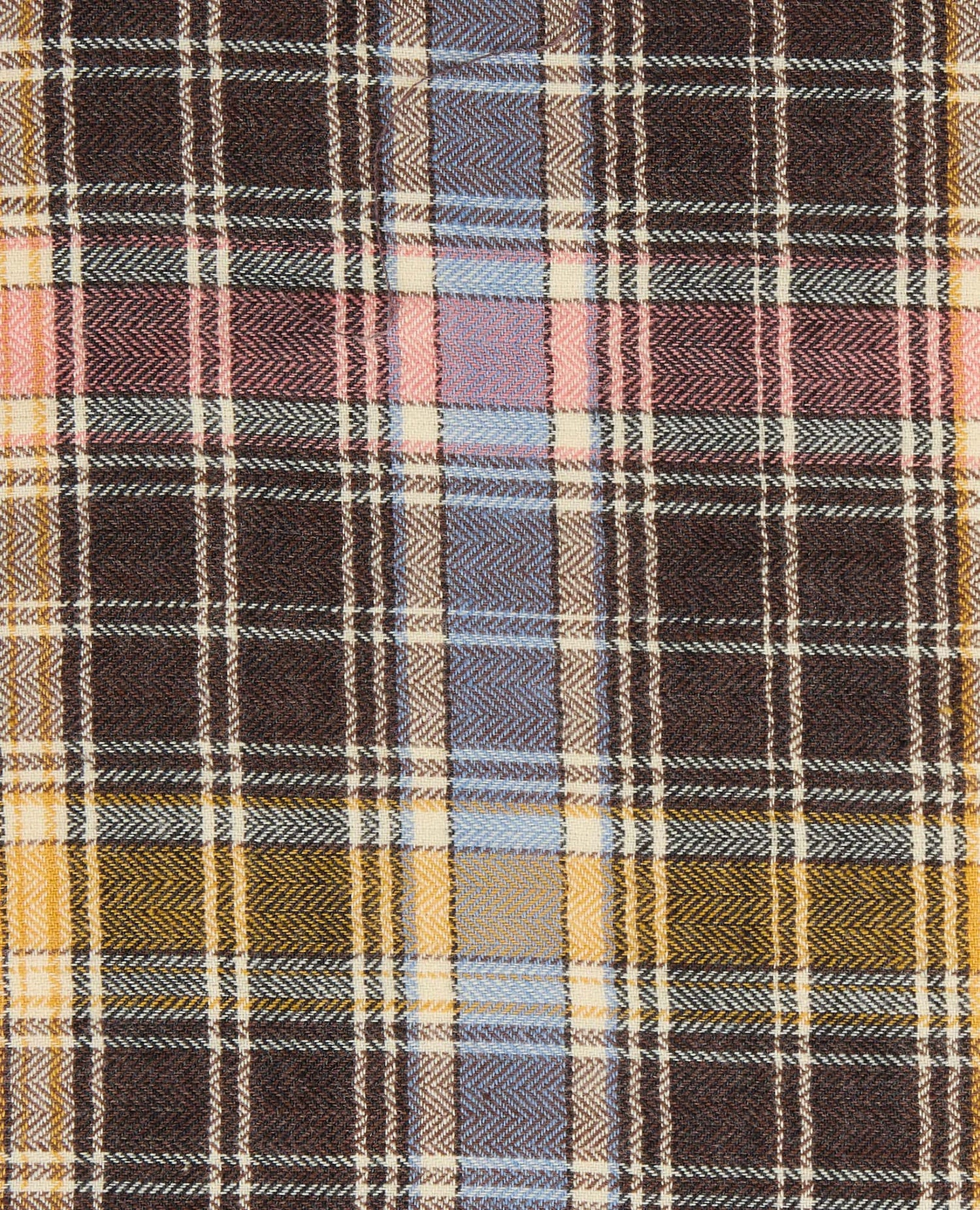 Close-up of a plaid fabric with brown, yellow, and blue pattern