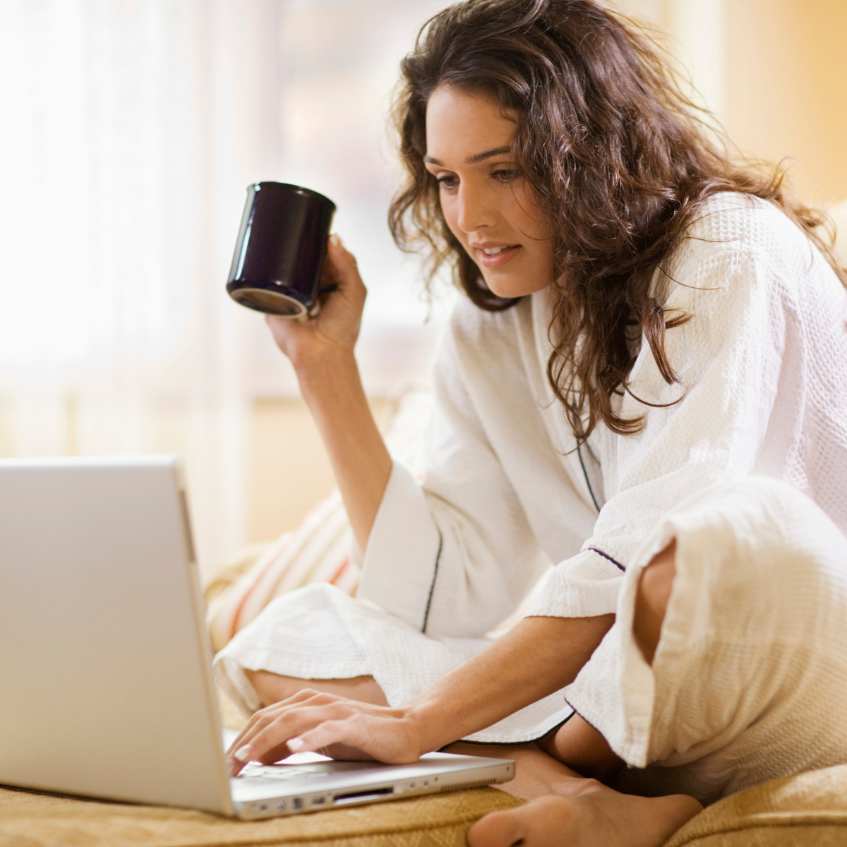 woman shopping from home with laptop