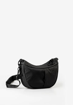 Aunts & Uncles Toyo RE Lite Halfmoon Bag. A black crescent-shaped nylon shoulder bag with an adjustable shoulder strap, photographed on a seamless white studio background.