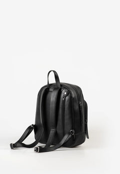 Aunts & Uncles Coco Leather Backpack Purse A black leather backpack shown from a side profile view against a clean white studio background.