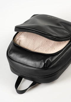 Aunts & Uncles Coco Leather Backpack Purse.  Black backpack with open front pocket on a white background