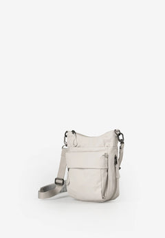 Aunts & Uncles Yura RE Lite Crossbody Bag. A light beige nylon shoulder bag with a front zippered pocket and a matching adjustable shoulder strap, shown against a plain white background.