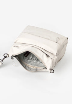 Aunts & Uncles Nanuki RE Lite Crossbody Bag. White handbag with a visible brand label on a white background