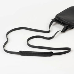 Aunts & Uncles Tulip Leather Phonebag Wallet. A black leather crossbody bag with a matching adjustable shoulder strap, shown on a clean white background.