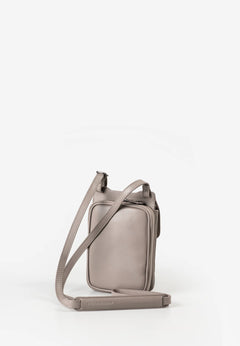 Aunts & Uncles Tulip Leather Phonebag Wallet. A taupe leather crossbody phone bag with a matching adjustable shoulder strap, displayed on a clean white background.