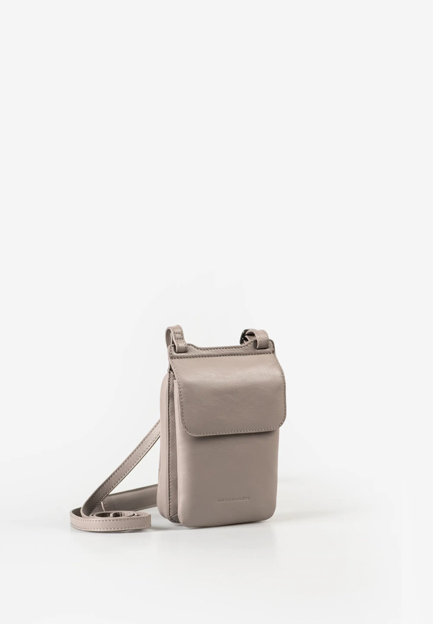 Aunts & Uncles Tulip Leather Phonebag Wallet. A small taupe leather crossbody phone pouch with a matching adjustable shoulder strap, shown on a clean white background.