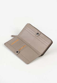 Aunts & Uncles Maple Leather Wallet. A taupe leather wallet shown open, displaying its interior card slots, snap-button closures, and a small orange accent card, set against a plain white background.