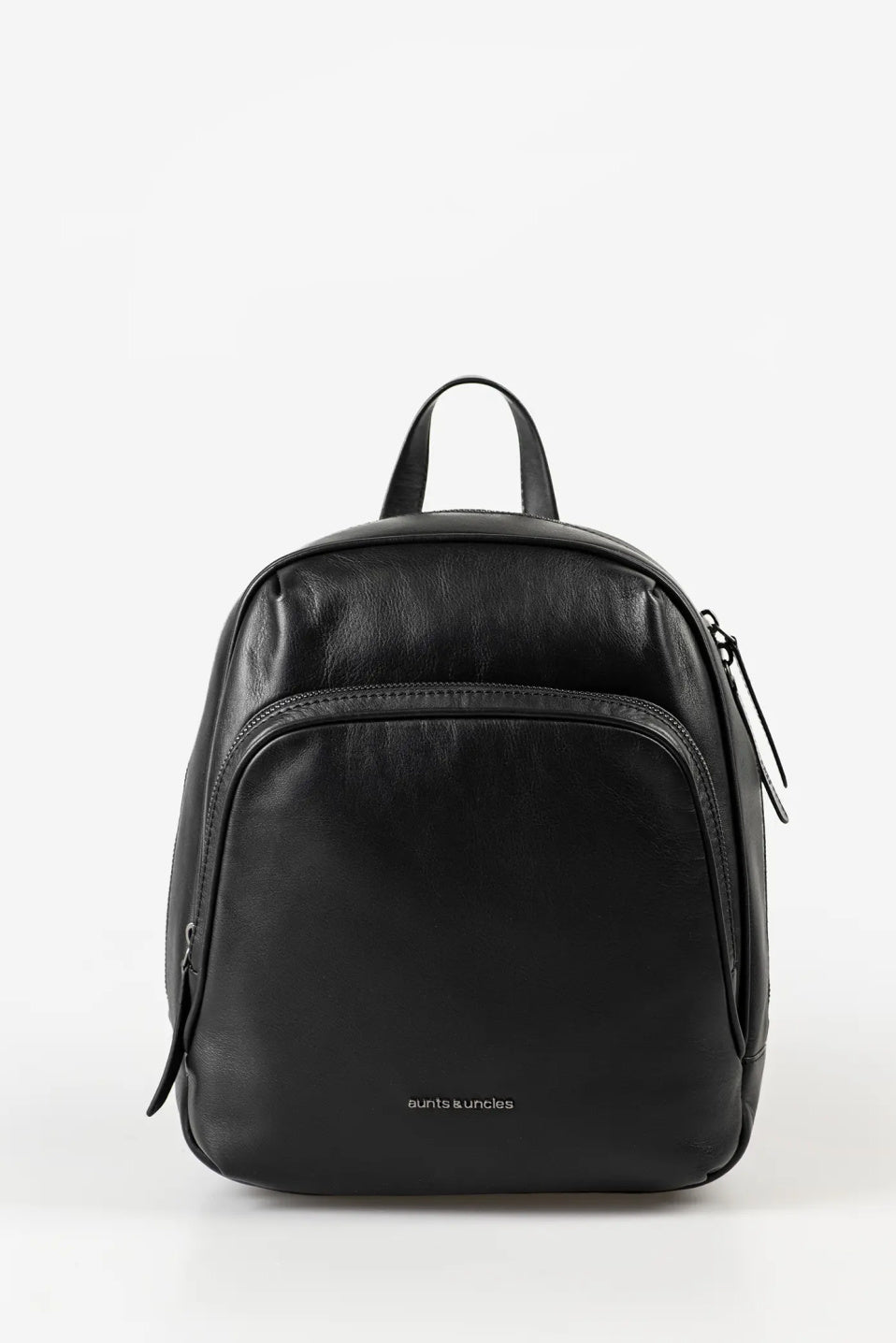 Aunts & Uncles Coco Leather Backpack Purse.  A black leather backpack with a top handle, front zippered pocket, and a small gold 'satchels & unlocks' logo at the bottom center, shown against a plain white background.