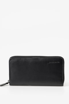 Aunts & Uncles Maple Leather Wallet. A black leather zip-around wallet with a subtle pebbled texture and a small debossed logo on the top right, shown against a plain white background.