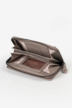Aunts & Uncles Maple Leather Wallet. An open metallic taupe zip-around wallet with multiple card slots and a brown interior cardholder, shown on a clean white background.