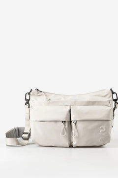 Aunts & Uncles Mogami RE Lite Crossbody Bag. A light beige nylon shoulder bag with multiple front zippered pockets and a detachable shoulder strap, shown against a plain white background.
