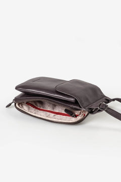 Aunts & Uncles Tulip Leather Phonebag Wallet. A dark brown leather crossbody bag shown open, displaying its interior compartments, zipper, and a light pink lining, set against a plain white background.
